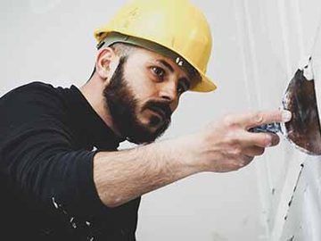 Plasterer applying stucco with a trowel